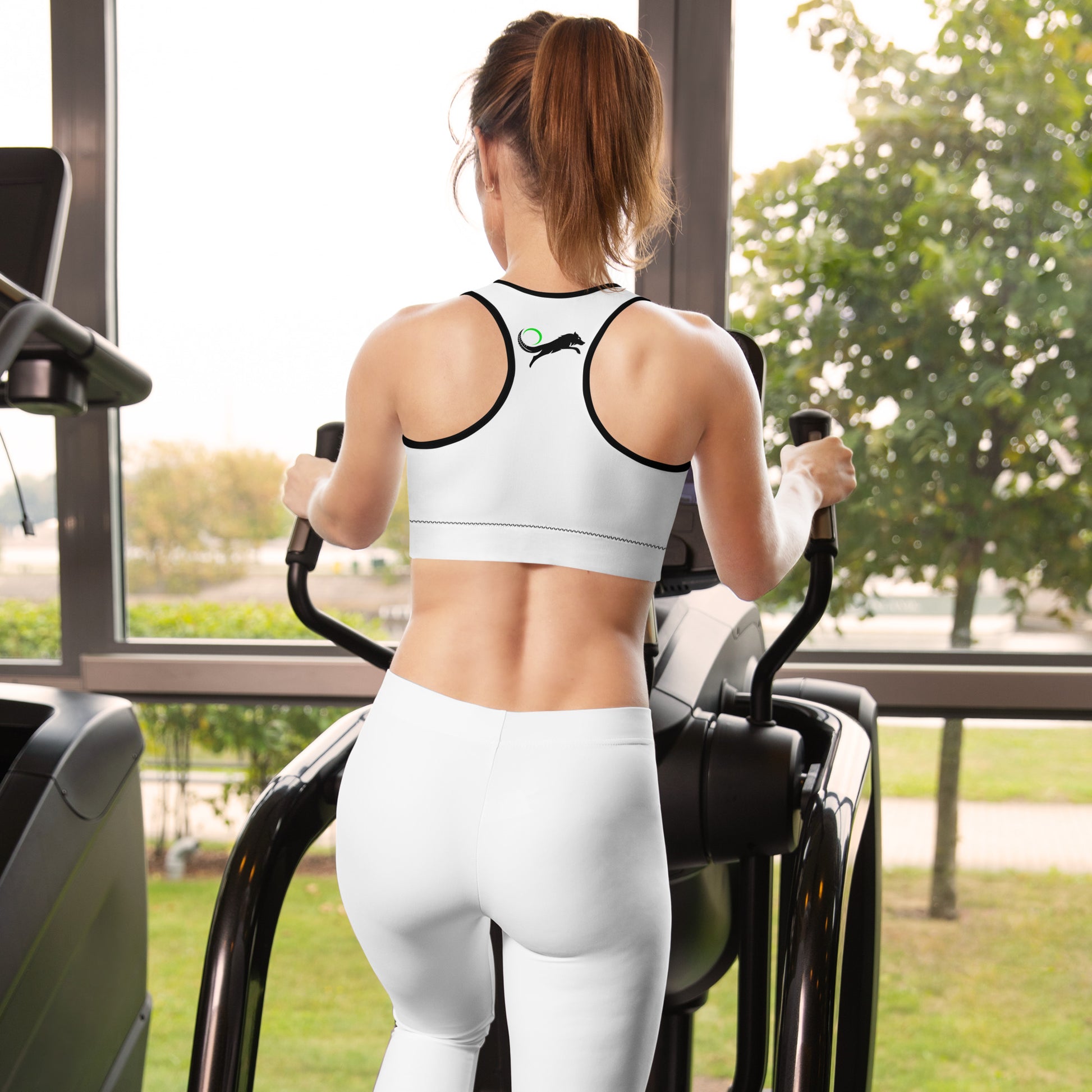 womens back of white sports bra with black logo on back