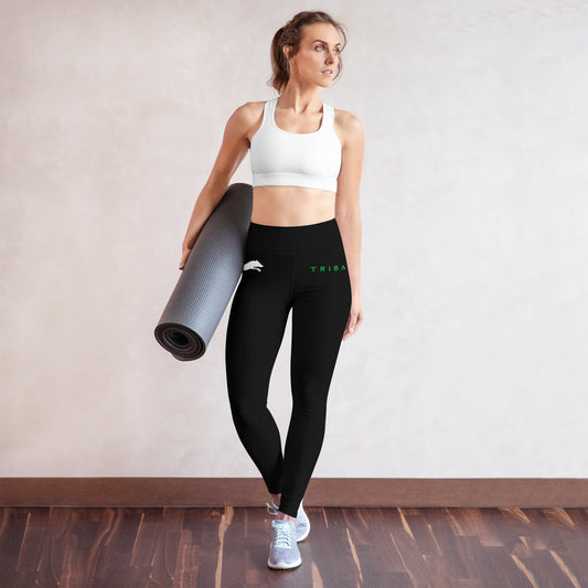 womens black leggings with white wolf logo on right hip and tribal in green text on left hip