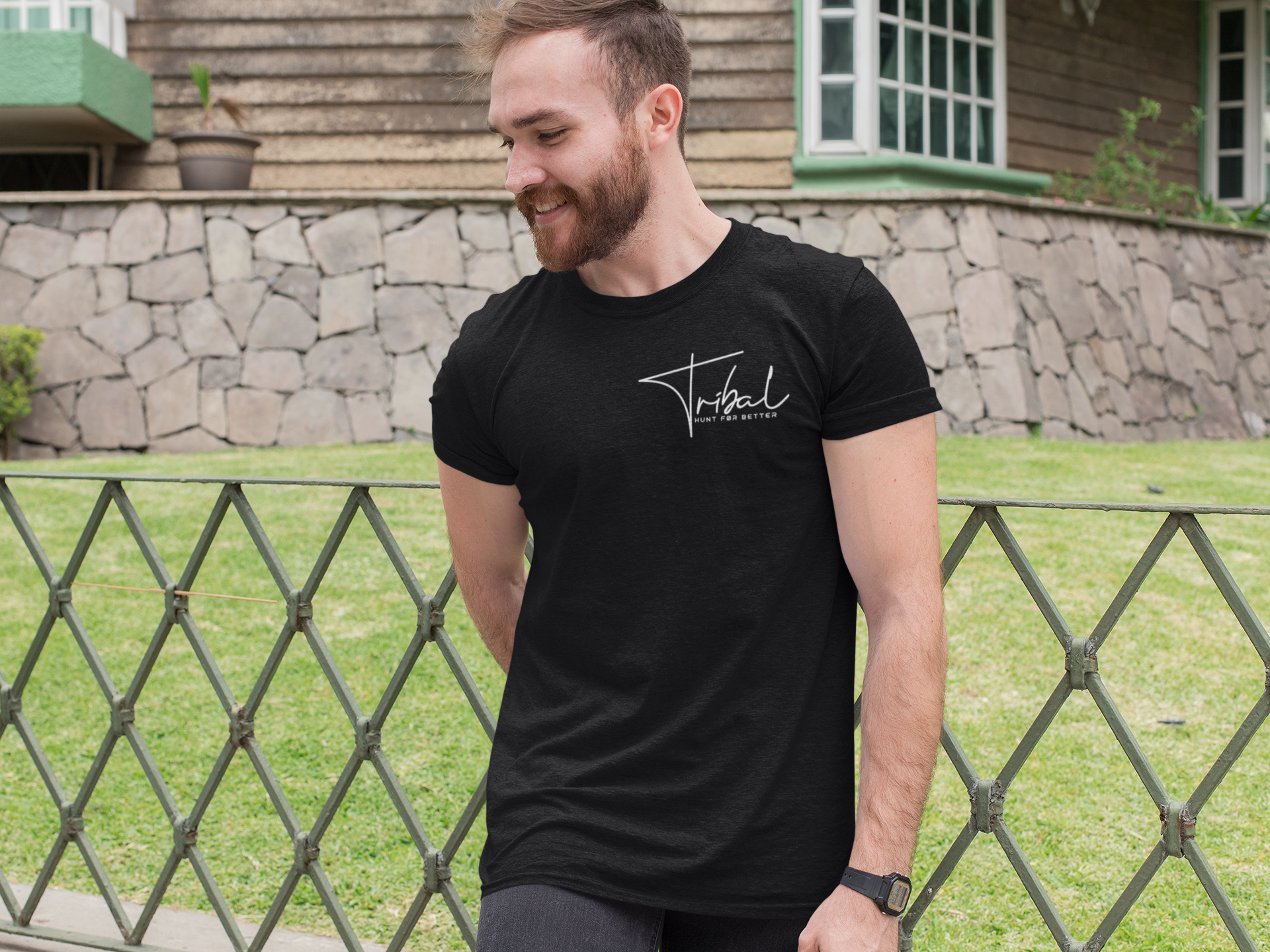 Man posing with black Tribal chest logo t-shirt